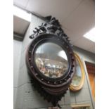 An eagle topped convex mirror