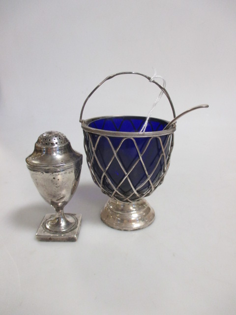 A blue glass lined silver sugar bowl, London 1906, a sifter spoon together with a George III