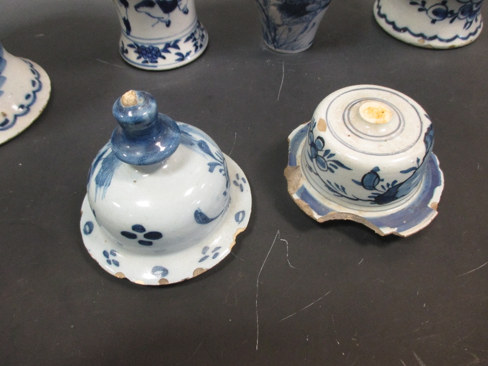 An 18th century Delft blue and white baluster vase and cover; two Delft blue and white ovoid vases - Image 3 of 3