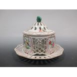 A Continental porcelain lidded pot pourri vase and cover on stand, decorated with birds