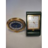 An oval Jaeger LeCoultre travel clock with lapis lazuli face and another green leather Jaeger