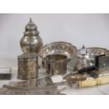 An unmarked repousse silver matchbox sleeve, an ashtray modelled as a German dessert dish and