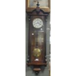 A Victorian walnut Vienna wall clock, typical glazed case with two part dial, twin weight