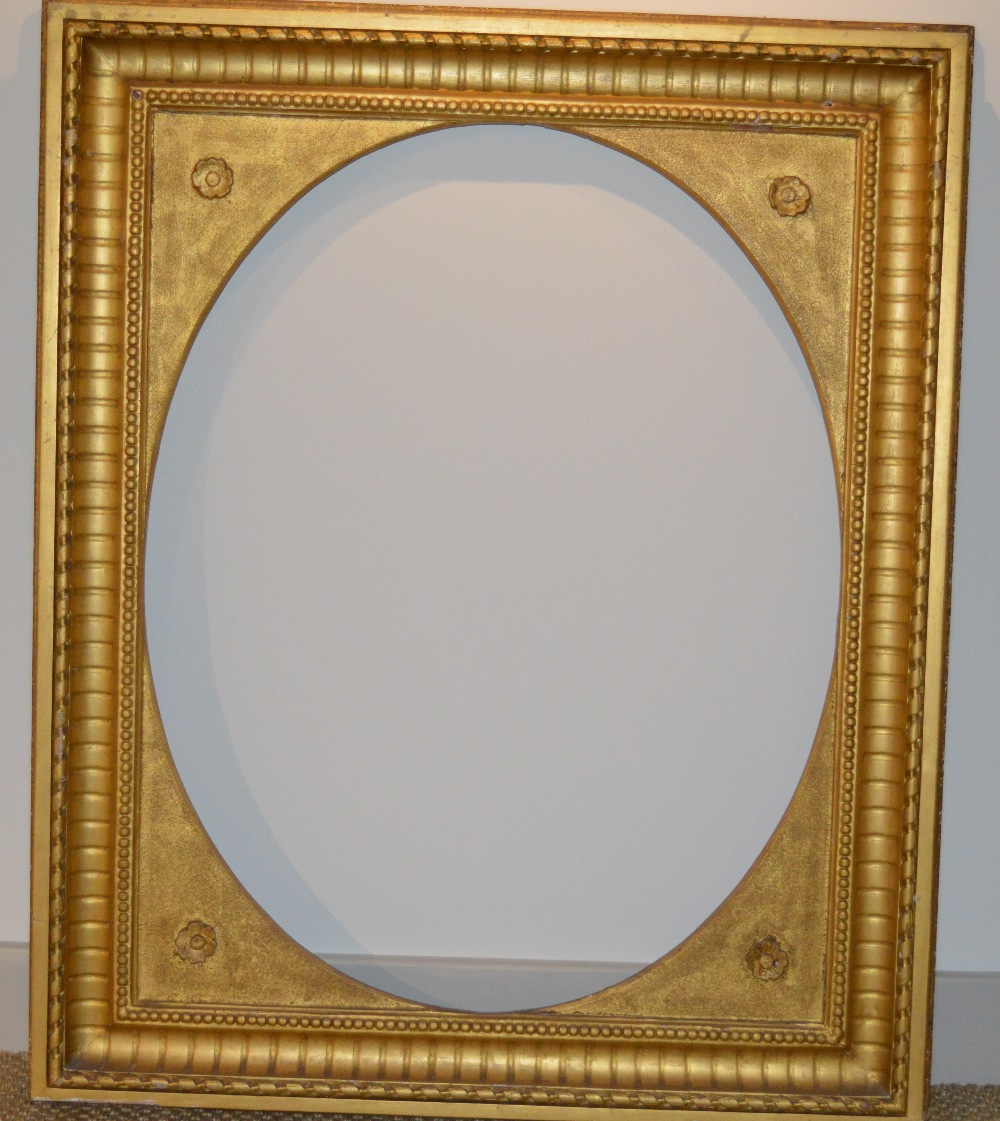 A gilded 19th Century plaster frame with inset floral corners, some chips, 73 x 57 cm sight size; - Image 2 of 2