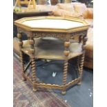 An octagonal centre table with carved freize, shelf and barley twist legs, a/f, 72 x 75cm