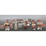A collection of porcelain models of Suffolk houses (26)