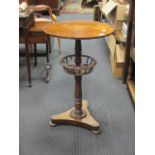 A Victorian mahogany circular work table with wool basket, on a triform base 70 x 44cm