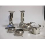 A pair of silver candlesticks, London 1897, a pair of silver tub salts, London 1872, a silver