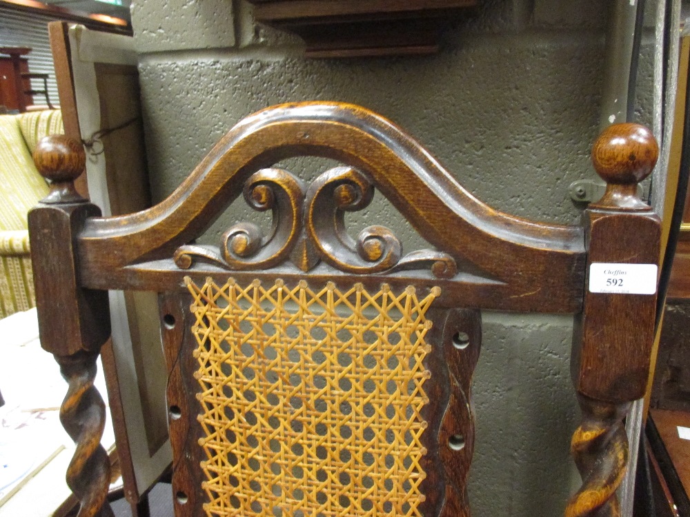 A Jacobean style open armchair with carved and caned back outswept arms, needlepoint seat and turned - Image 2 of 3