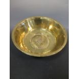 A copper coal bucket, a brass bowl, an antique elm yoke, a pair of bellows, and other metalware