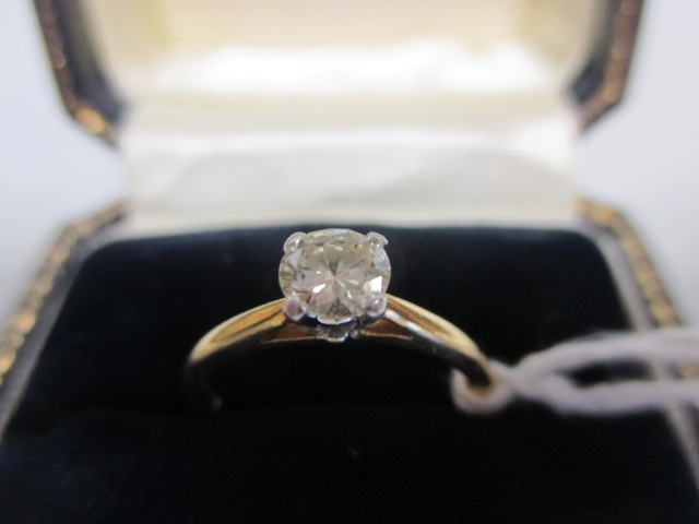 An 18ct single stone diamond ring, the round brilliant cut diamond estimated approx. 0.43cts, in a