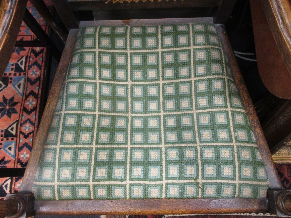 A Jacobean style open armchair with carved and caned back outswept arms, needlepoint seat and turned - Image 3 of 3