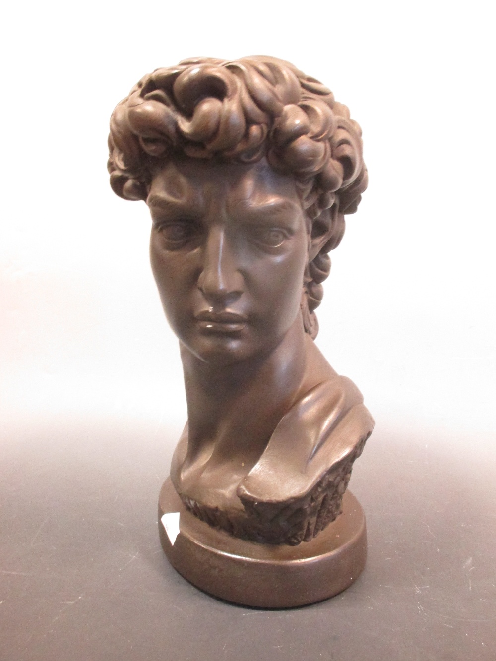 A modern bronzed plaster bust of Apollo 35cm high