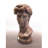 A modern bronzed plaster bust of Apollo 35cm high