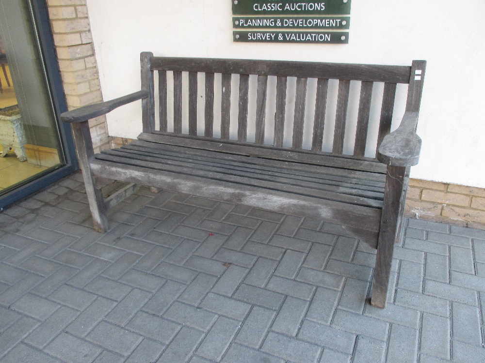 A teak garden bench with brass plaque ' made from timber from HMS Ganges', 153cm wide