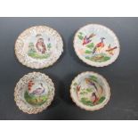 A pair of Meissen rustic cups and saucers, each decorated with birds and sprigs (2)