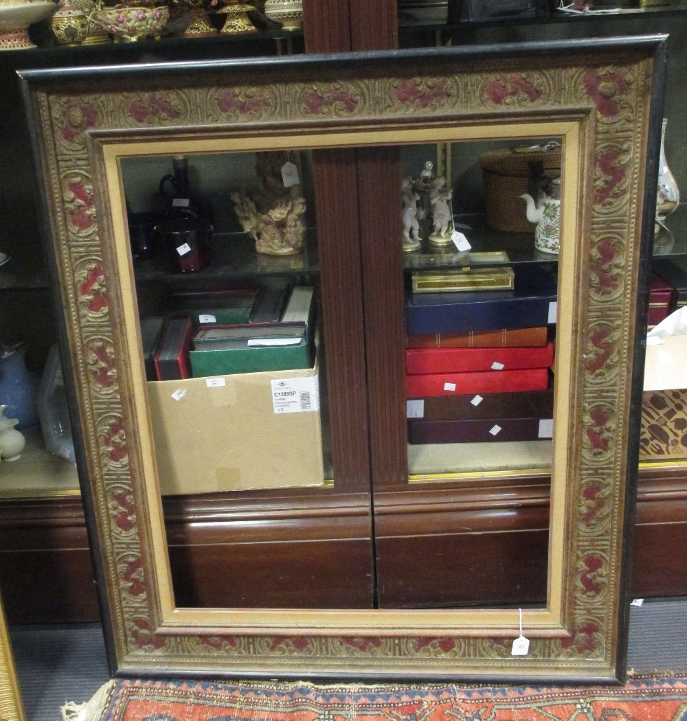 A parcel gilt and painted gesso moulded picture frame