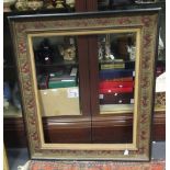 A parcel gilt and painted gesso moulded picture frame