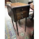 A 19th century mahogany drop flap work table