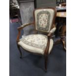 A French taste elbow chair upholstered in needlework