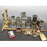A collection of pewter mugs, brass candlesticks, other metal ware, a walking stick and a coaching