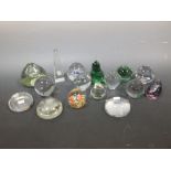 A collection of seventeen Caithness, Langham and other glass paperweights