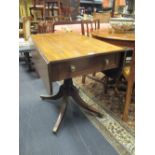 A Regency mahogany pedestal Pembroke table, with end drawers, on splayed legs and brass casters 89cm