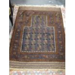 Four small tribal rugs including a prayer rug, 3 others with colourful fields, some fading and wear,