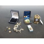 A silver charm bracelet, a modern miniature carriage clock and other items