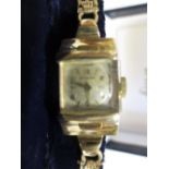 A lady's 9ct wristwatch by Dugena, in later case