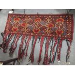 Two tribal tent hangings, largest 140 x 55cm, tent bands, small rugs or mats