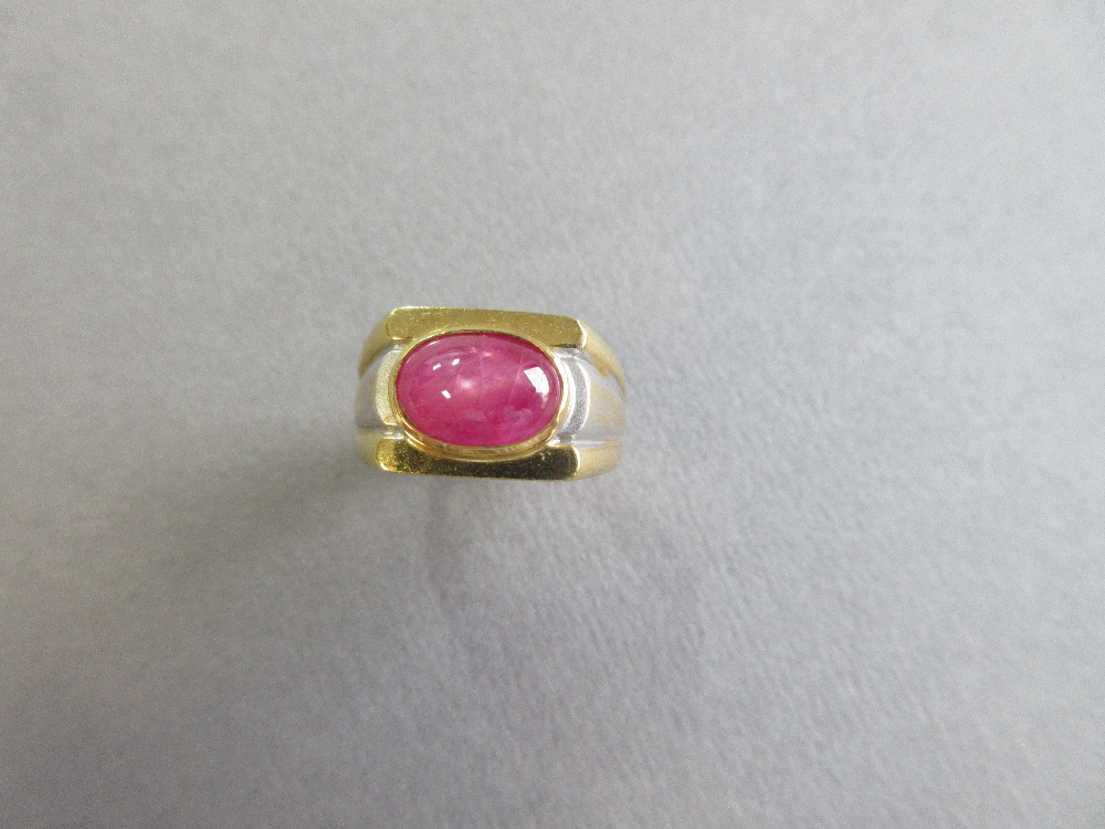 A star ruby single stone ring, the oval cabochon ruby set horizontally in a collet on a flat - Image 2 of 6