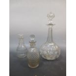 A large 19th century cut glass decanter and two small Regency cut glass decanters (3)