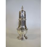 A silver sugar caster, London 1930, 19cm high, 5oz