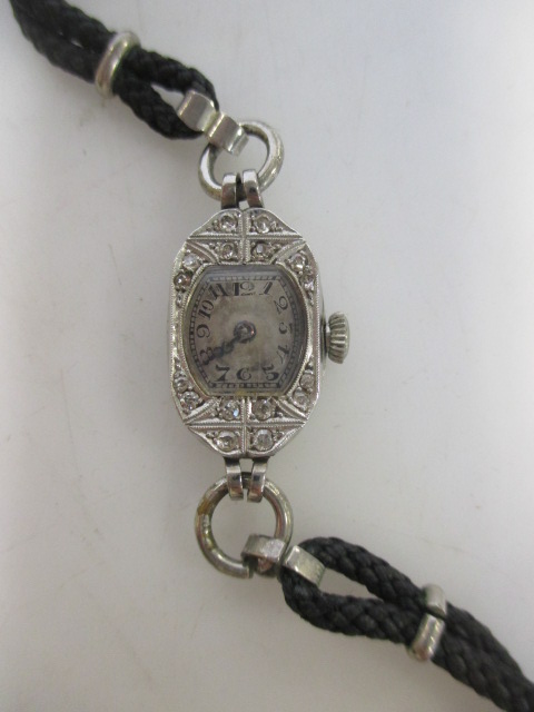 An Art Deco platinum and diamond set cocktail watch