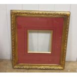 A quantity of gallery and exhibition frames, including two larger painted wooden frames, smaller
