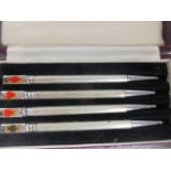 A cased set of four silver bridge pencils