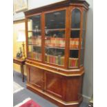 A 19th century Dutch walnut vitrine, with glazed upper half and brushing slide with panelled doors