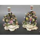 A pair of Dresden porcelain figural chamber sticks with floral bocage (2)