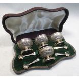 A set of four Victorian salts and spoons, by Robert Hennell IV, London 1869, of lobed pedestal