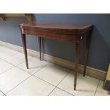 A Sheraton period mahogany and satinwood crossbanded fold over top card table with bow and