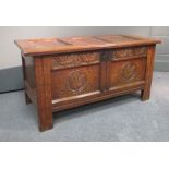 A small 18th century oak panelled coffer. 104cm wide