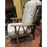 A pair of dark stained Ercol lounging chairs (2)