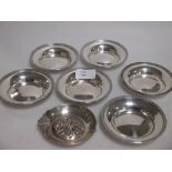 A small Continental silver 925 standard dish and a set of six small silver sweatmeat dishes, all