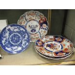 Three Imari dishes and a later blue and white plate