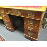 A twin pedestal desk with leather inset top and brass handles 71 x 105 x 60cm