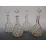 A set of four 19th century cut glass and engraved decanters with stoppers (4)