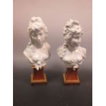A pair of German porcelain busts of ladies