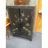 A Chinese black lacquer cabinet with coloured cut work flowers and birds 132 x 87 x 46cm