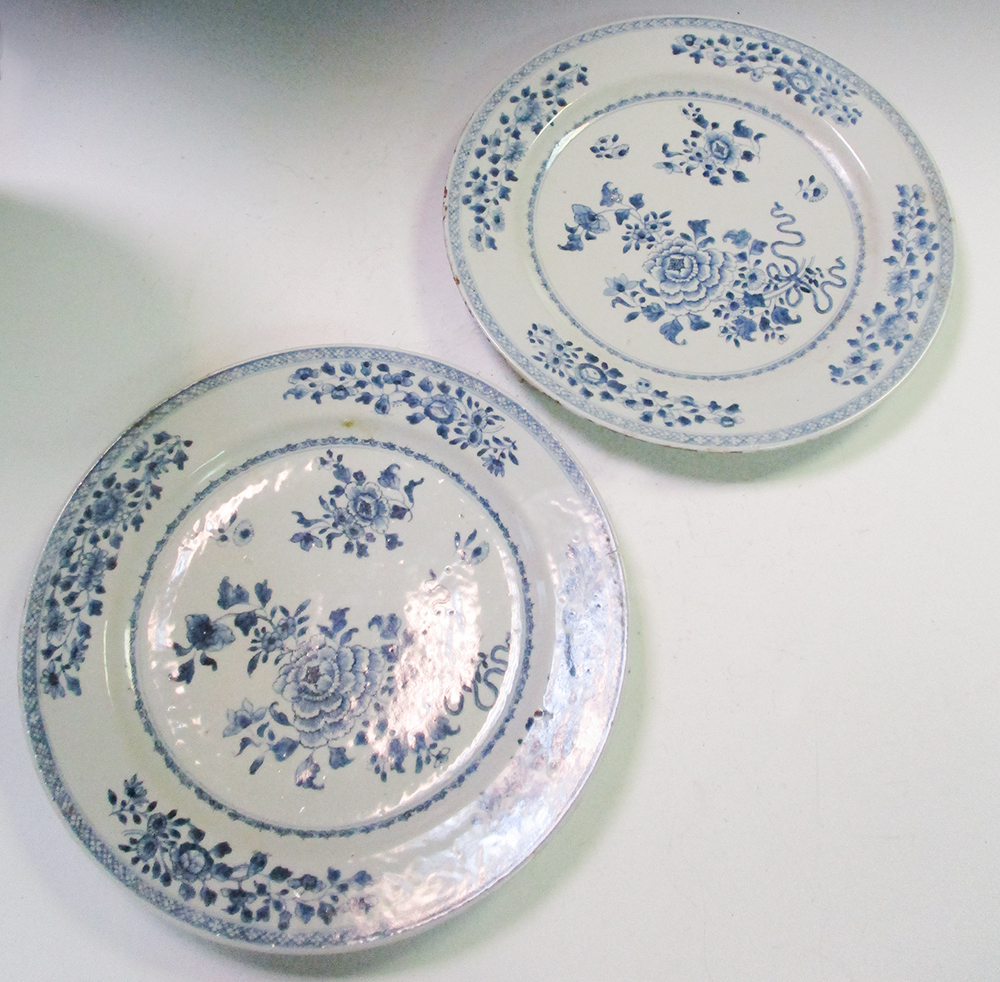 A pair of 18th century Chinese blue and white plates and another smaller (3) One has a chip and